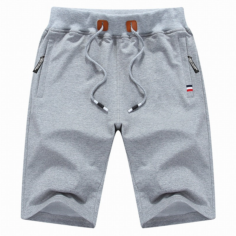 Men's durable drawstring casual shorts with secure zippered pockets, offering comfort & convenience.