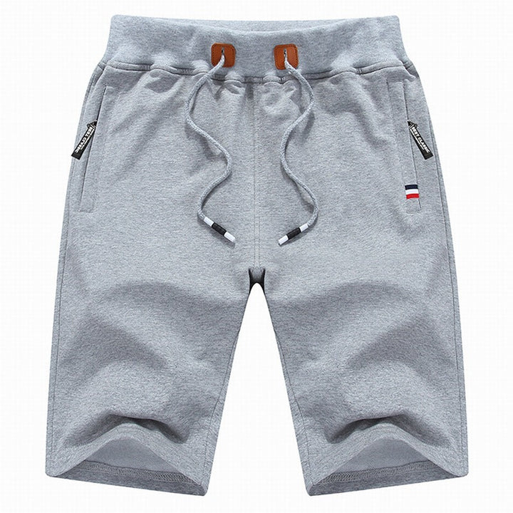 Men's durable drawstring casual shorts with secure zippered pockets, offering comfort & convenience.