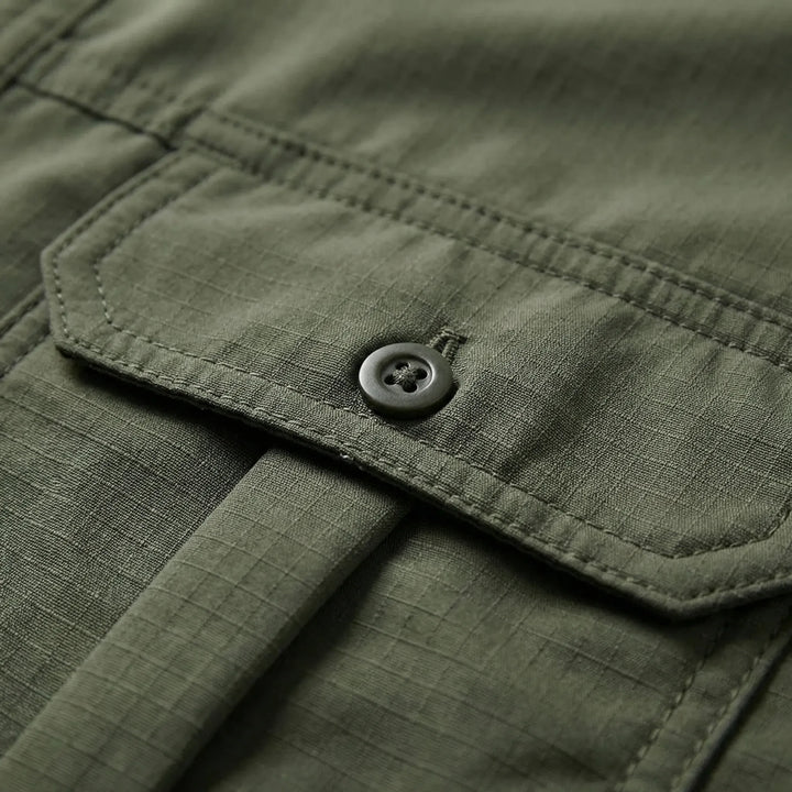Man hiking in a durable, quick-dry convertible outdoor shirt with zip-off sleeves.