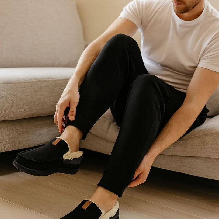 Comfortable men's slip-on house shoes, ideal for relaxing indoors.