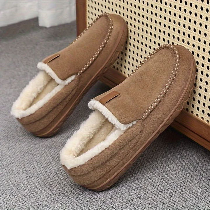 Soft men's indoor slippers with an easy slip-on design for daily wear.