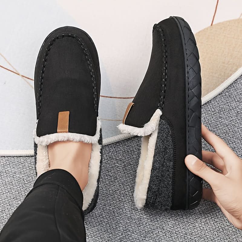 Plush men's house slippers offering warmth and comfort during cold months.