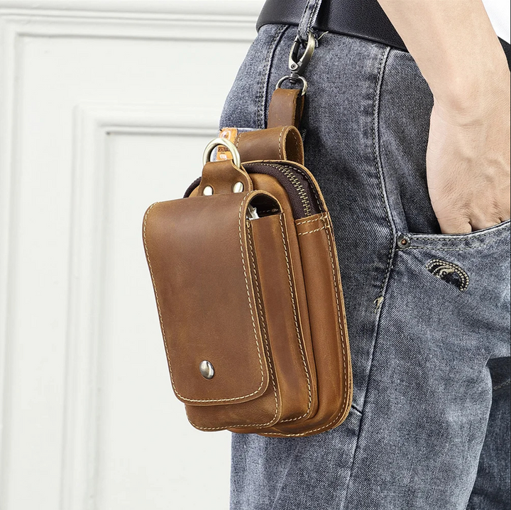 Men's versatile brown everyday carry pouch worn as a crossbody. Perfect utility bag for phone, keys, and travel essentials.