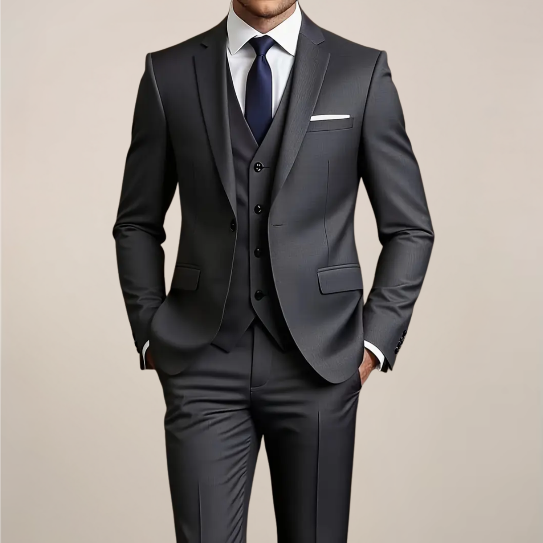 Men's dark grey slim fit three-piece suit. Perfect tailored formal wear for weddings, business events & special occasions.