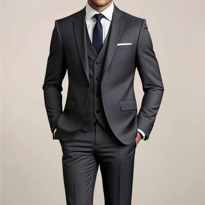 Men's dark grey slim fit three-piece suit. Perfect tailored formal wear for weddings, business events & special occasions.
