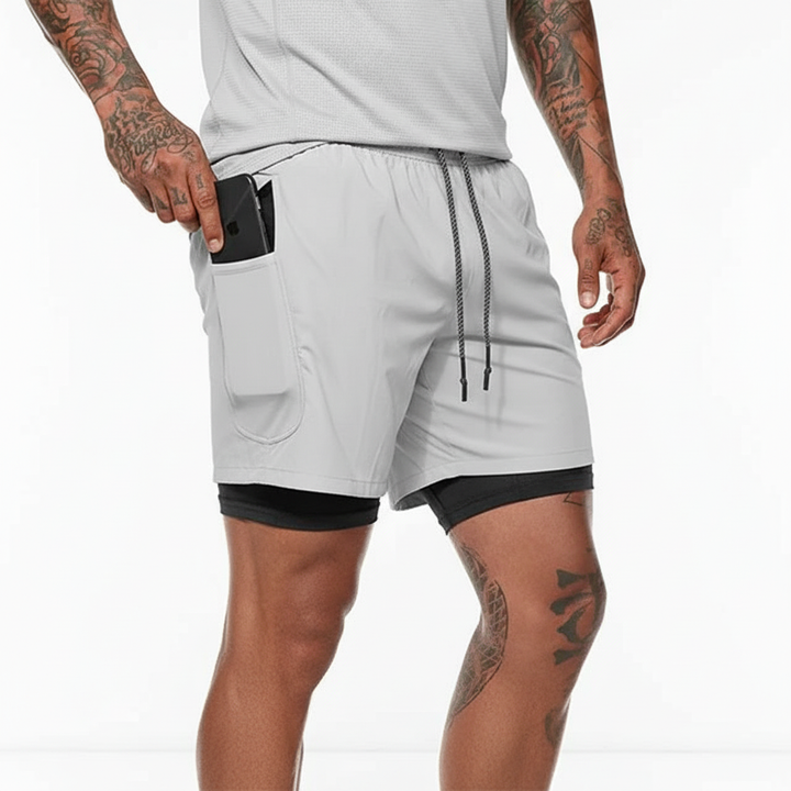Side view of men's gray double layer running shorts, showcasing the secure phone pocket & sleek design.