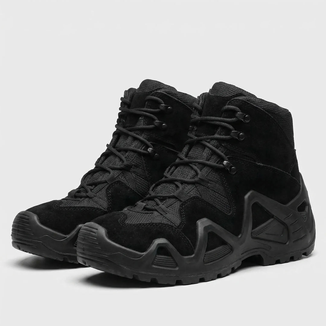 Close-up of tough, waterproof material on men's tactical boots for all-terrain use.