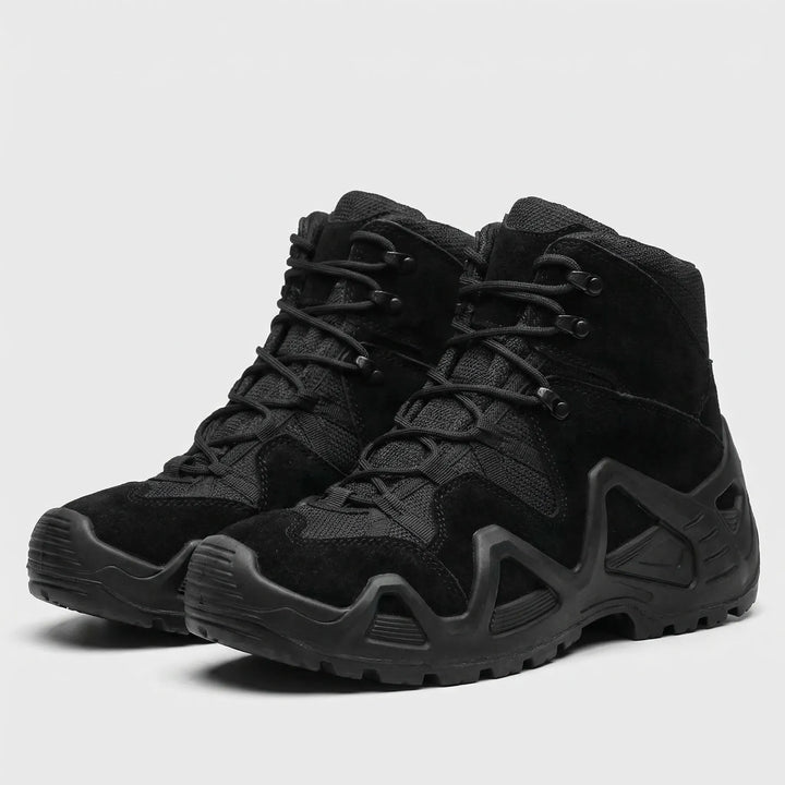 Close-up of tough, waterproof material on men's tactical boots for all-terrain use.