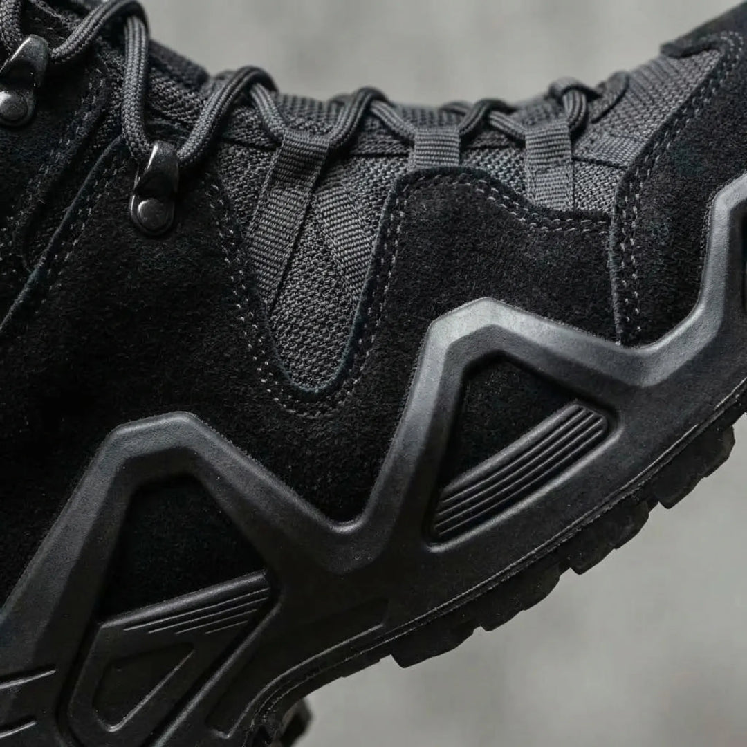 Aggressive non-slip outsole of men's hiking boots, providing superior grip on trails.