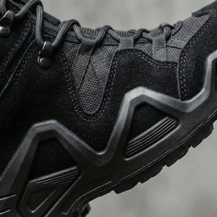 Aggressive non-slip outsole of men's hiking boots, providing superior grip on trails.