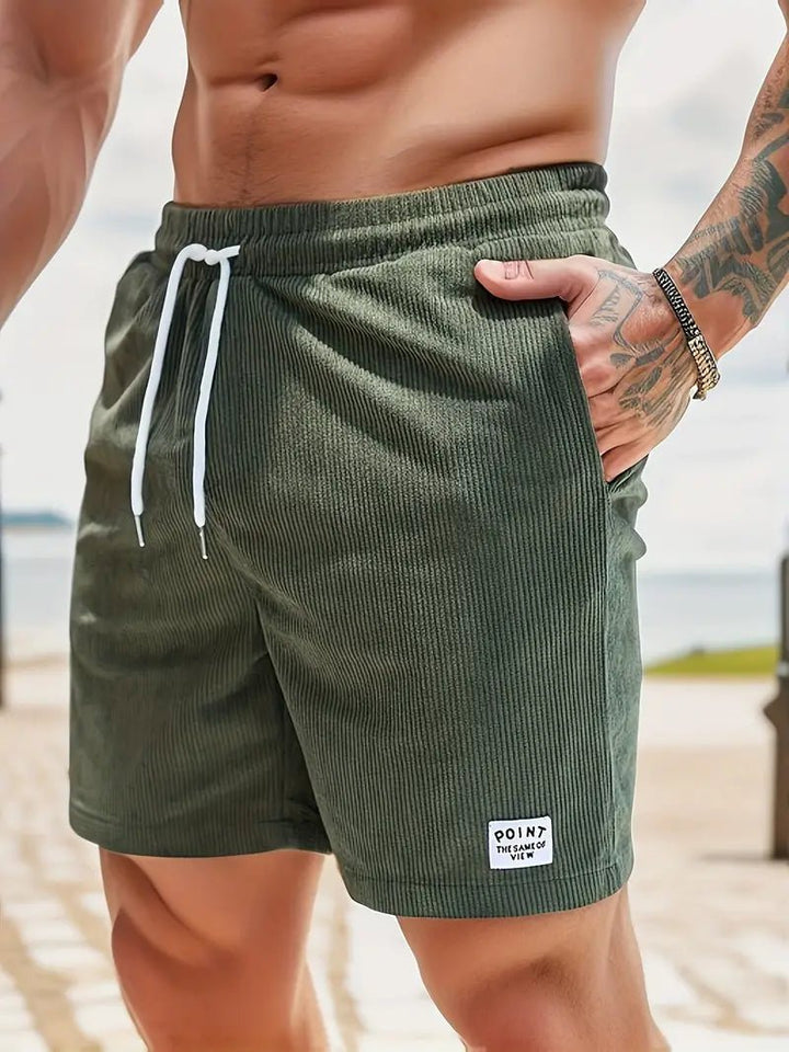 Comfortable quick-dry men's beach shorts with elastic waist, perfect for vacation swimwear.