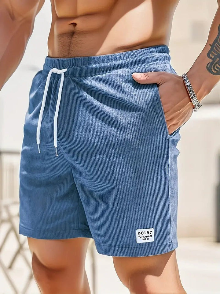 Solid color men's swimwear shorts, elastic waist & quick-dry for stylish summer beachwear.