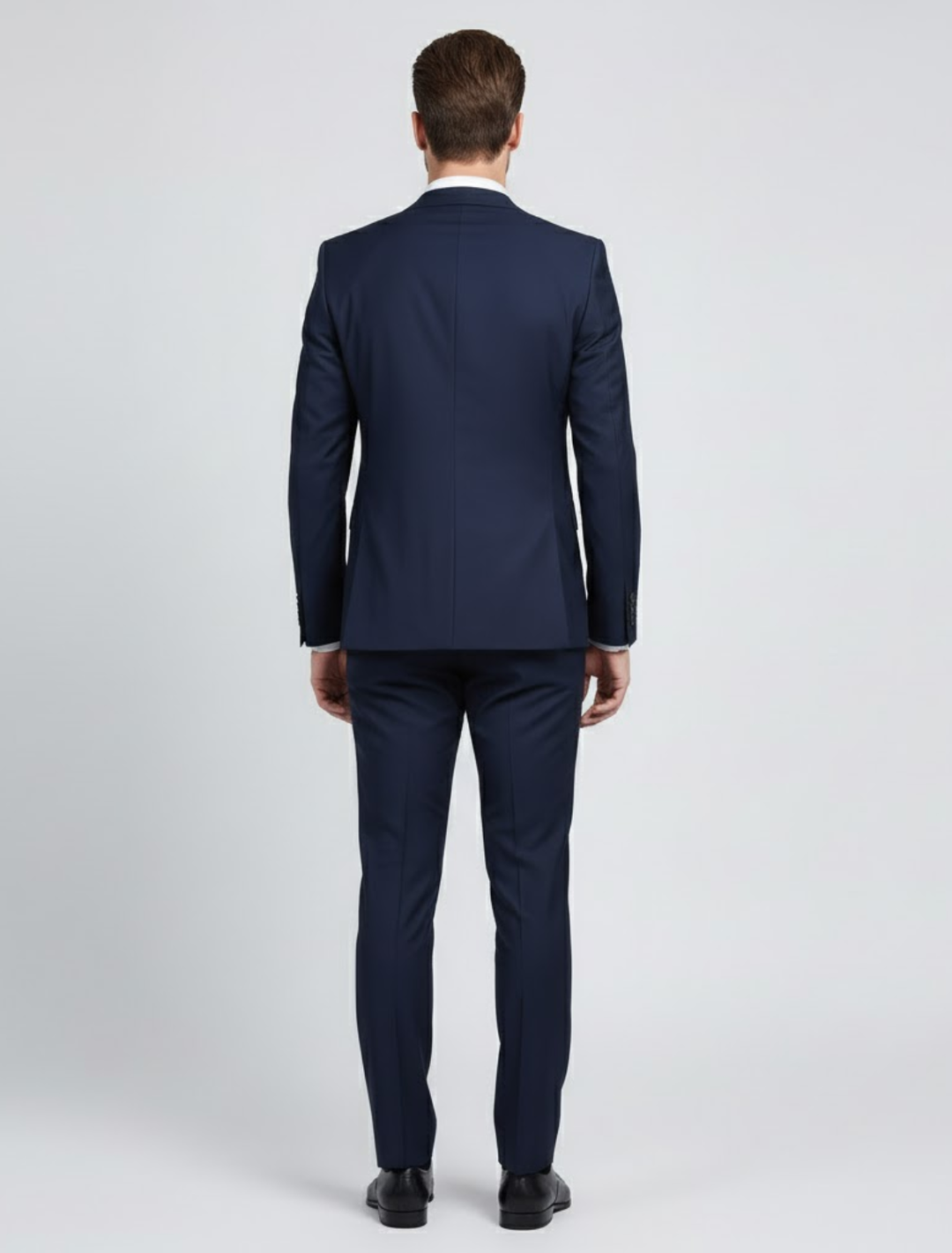 Sophisticated men's black two-piece suit, ideal for formal occasions & professional business wear. Stylish blazer & trousers.