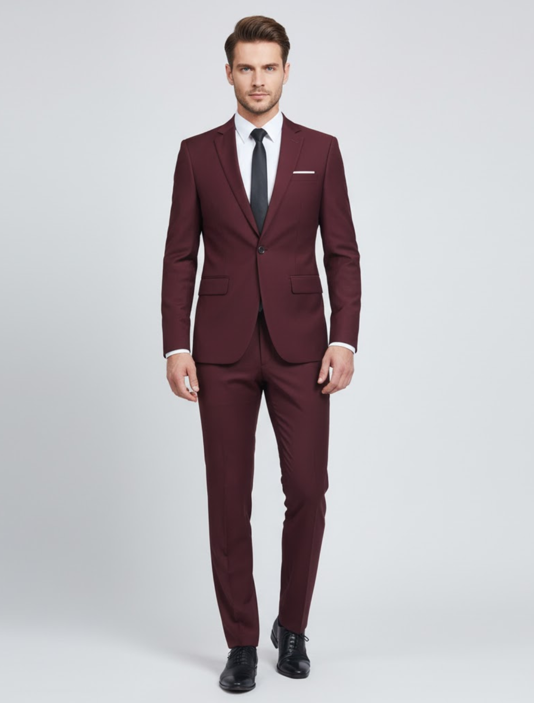 Modern men's two-piece suit in dark blue, offering a sharp blazer and comfortable trousers for versatile formalwear.