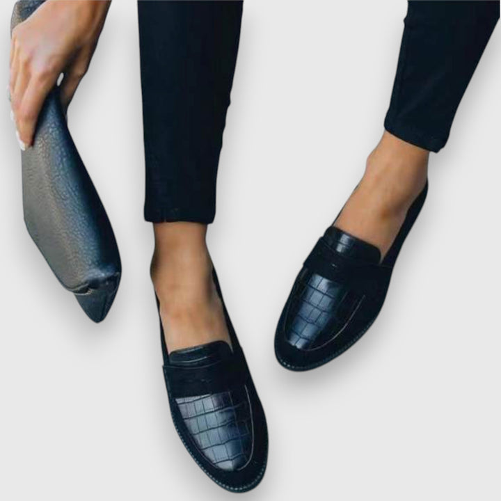 Stylish men's ergonomic black slip-on loafers providing all-day comfort. Perfect for smart casual & formal attire.