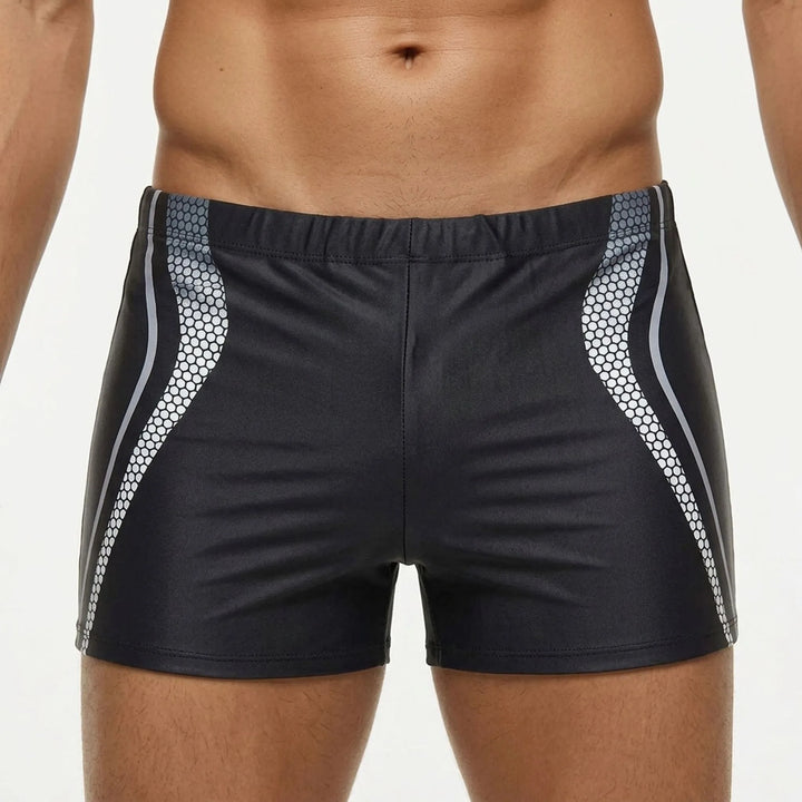 Stylish & functional men's fitted swim trunks, ensuring unrestricted movement for active beach and pool days.
