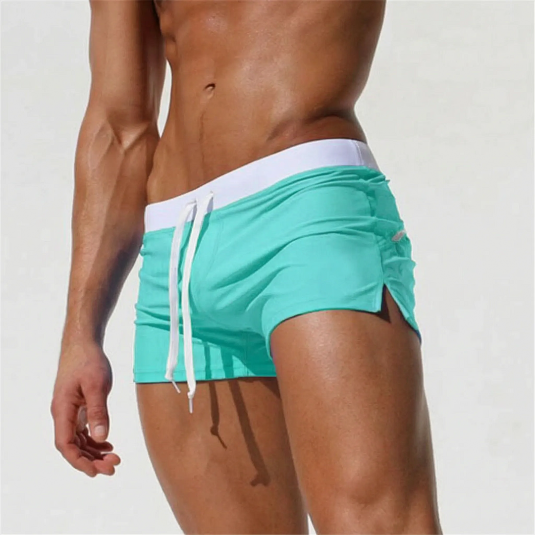 Modern men's fitted quick-dry swim trunks, designed for sleek style at the pool or beach.