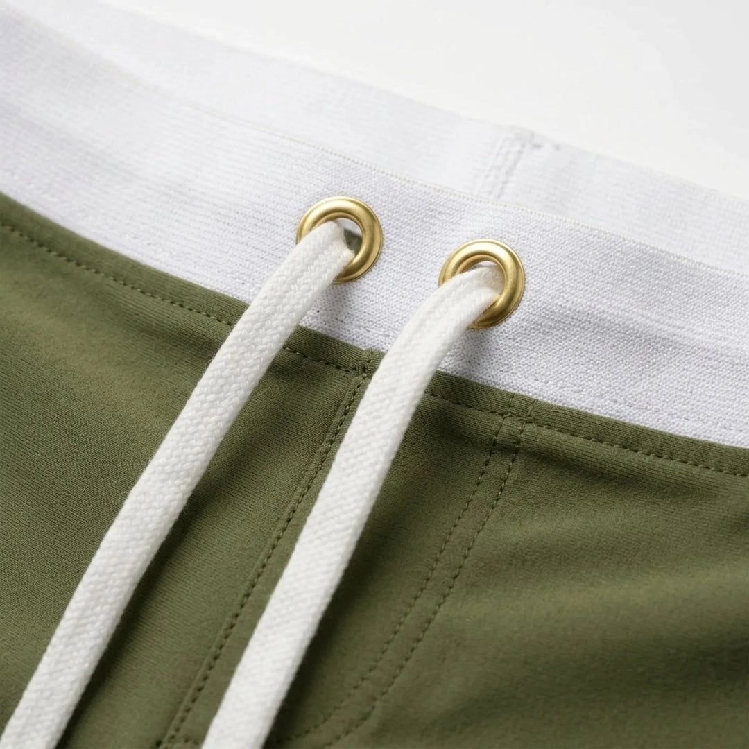 Stylish men's fitted swim trunks, quick-dry fabric, perfect for poolside fashion & comfort.