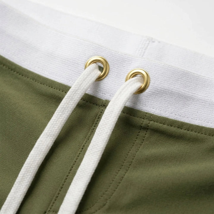 Stylish men's fitted swim trunks, quick-dry fabric, perfect for poolside fashion & comfort.