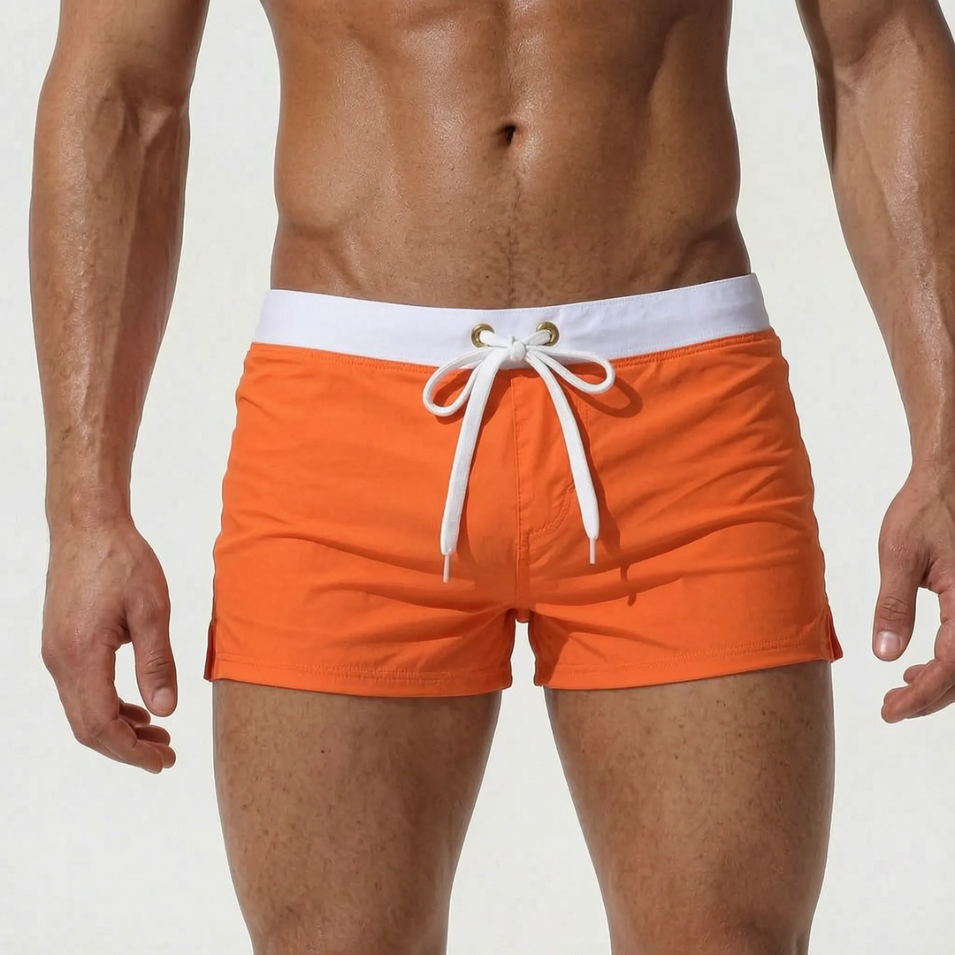 Fashionable men's fitted swim trunks with quick-dry fabric, great for summer style & the beach.