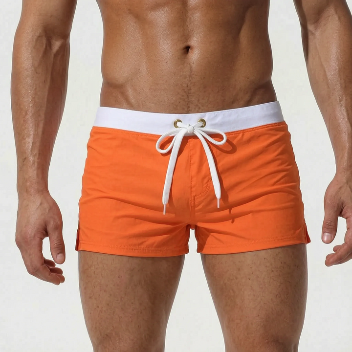 Fashionable men's fitted swim trunks with quick-dry fabric, great for summer style & the beach.