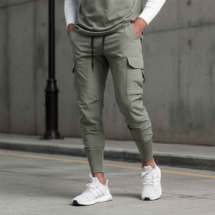 Men's flexible jogger pants with functional pockets. Comfortable stretch fabric for activewear & casual style.