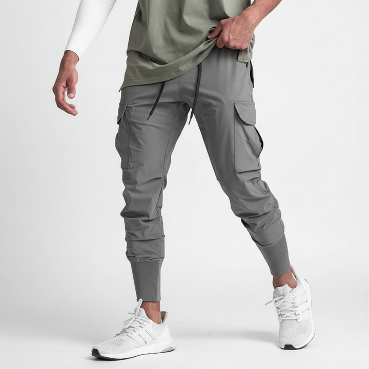 Men's multi-pocket stretch joggers. Flexible fit activewear for gym, streetwear, or relaxed casual comfort.