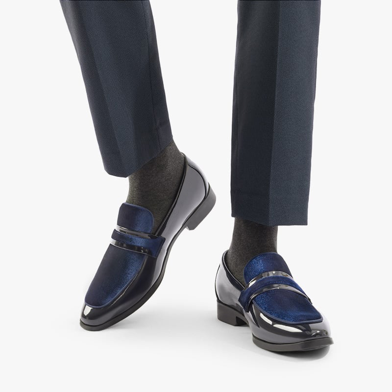 Detail of the glossy black finish on men's formal loafers, showcasing quality for sophisticated dress shoes.
