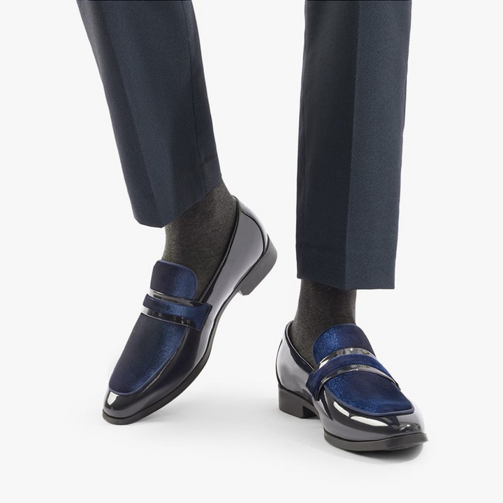 Detail of the glossy black finish on men's formal loafers, showcasing quality for sophisticated dress shoes.