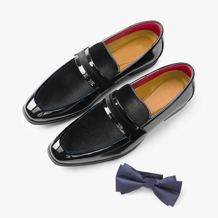 Side view of men's sleek dress loafers with a refined glossy finish, perfect for formal men's fashion.