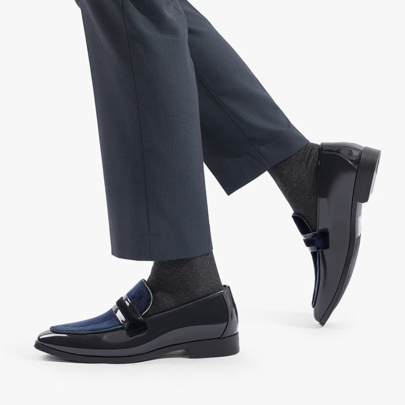 Black glossy men's dress shoes, slip-on loafers designed for a sharp, sleek formal look at any event.