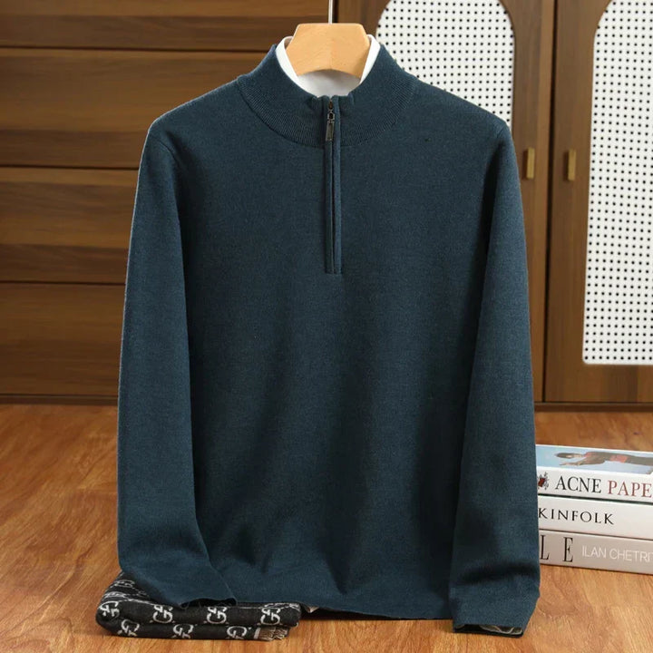 Detail view of men's half-zip mock neck sweater. Tailored fit pullover for smart business casual fashion.