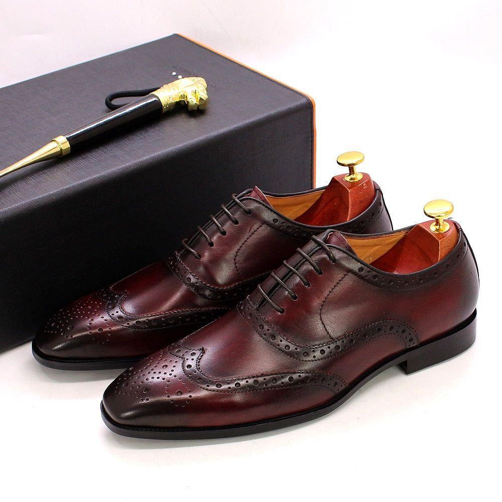 Men's handcrafted leather wingtip Oxford dress shoes, perfect for formal & business occasions.