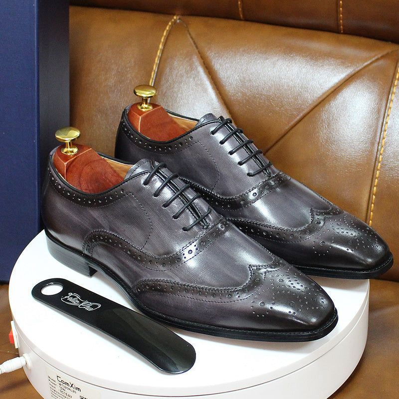 Elegant handcrafted men's wingtip Oxford dress shoes, stylish leather footwear for business & formal events.