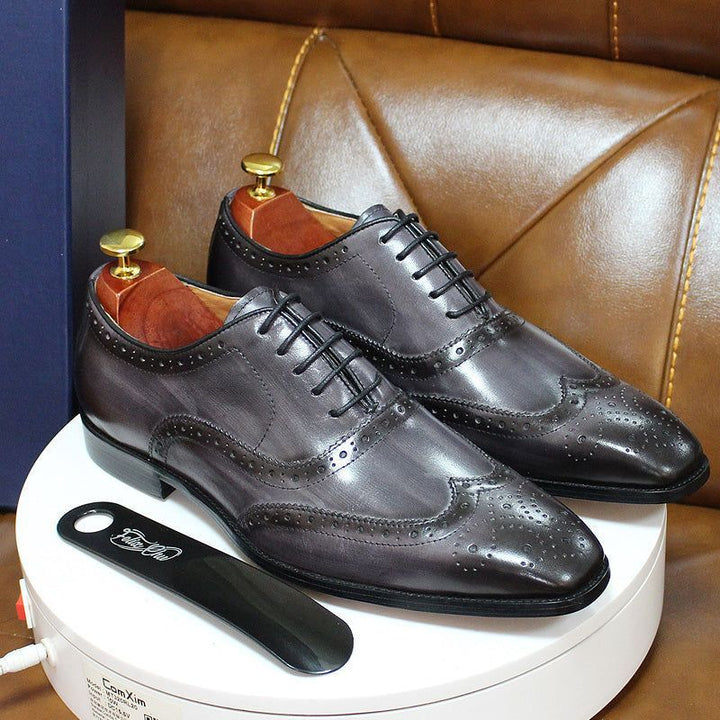 Elegant handcrafted men's wingtip Oxford dress shoes, stylish leather footwear for business & formal events.
