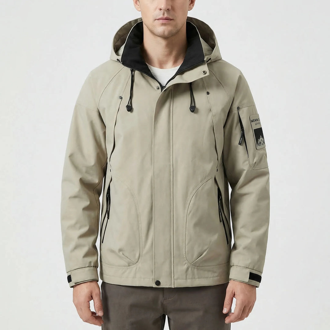 Durable men's hooded softshell windbreaker, offering lightweight rain protection for hiking and outdoor gear.