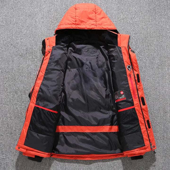 Men's insulated hooded parka in a snowy environment. Conquer cold with this warm, protective winter outerwear jacket.