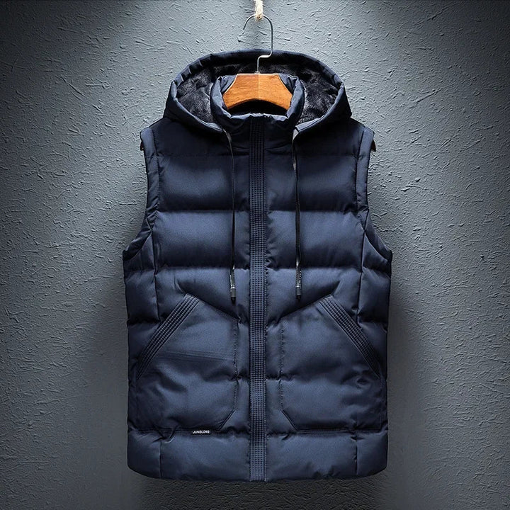 Men's insulated hooded puffer vest. Lightweight outerwear ideal for cold weather protection & casual layering.
