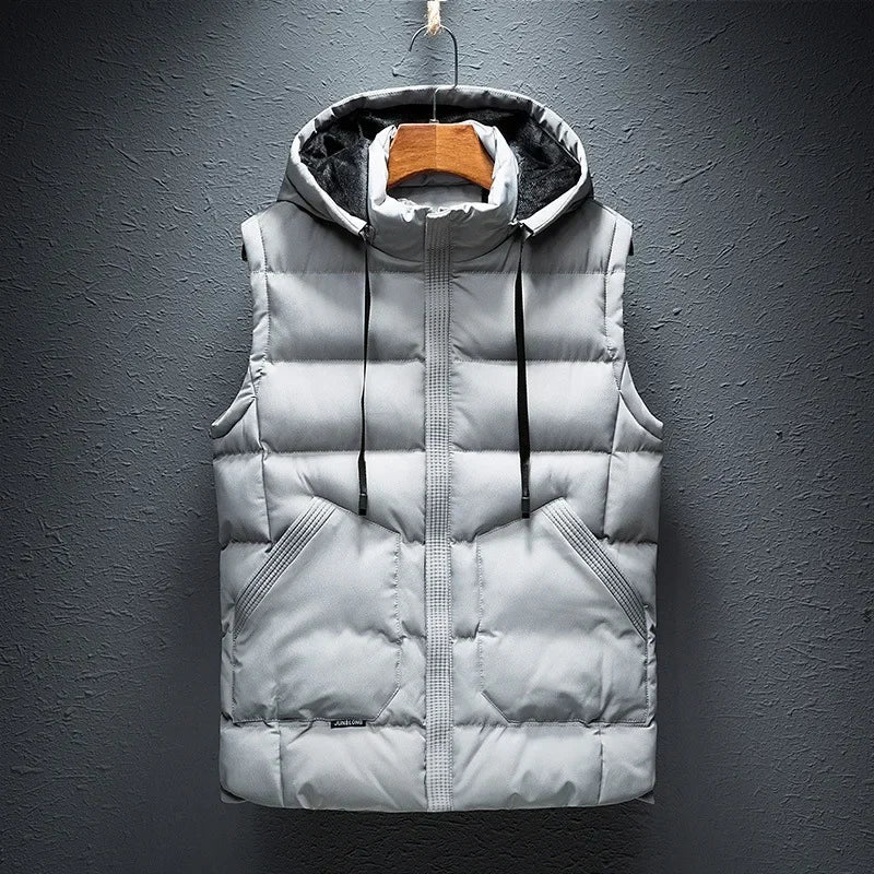 Stylish men's insulated puffer vest with hood. Durable, lightweight outerwear perfect for travel & casual wear.