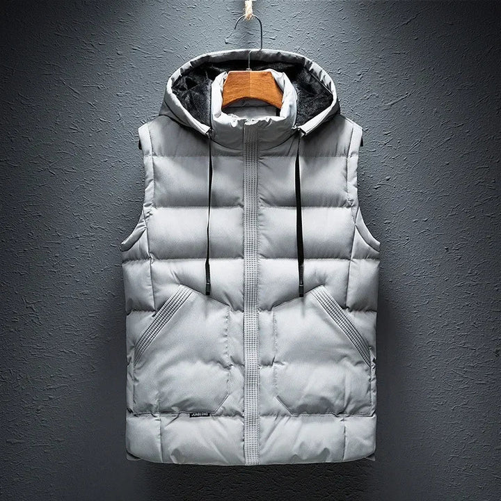 Stylish men's insulated puffer vest with hood. Durable, lightweight outerwear perfect for travel & casual wear.