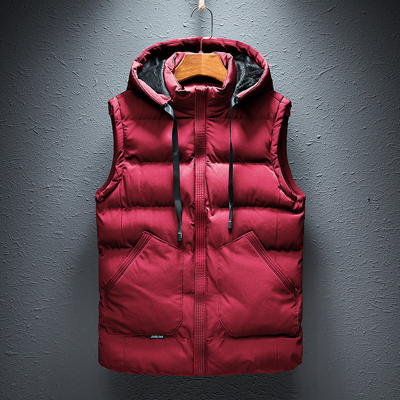 Warm men's hooded puffer vest, insulated for weather protection. Ideal lightweight outerwear for travel and layering.