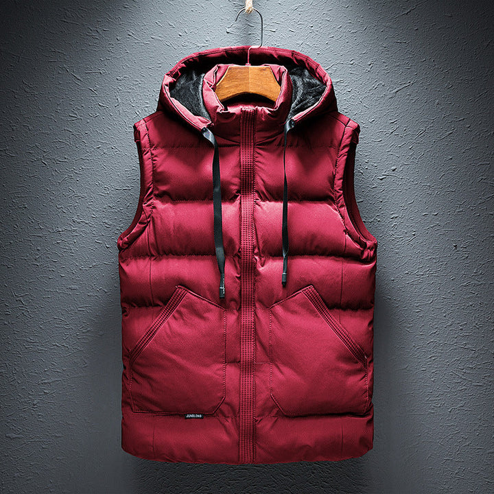 Warm men's hooded puffer vest, insulated for weather protection. Ideal lightweight outerwear for travel and layering.