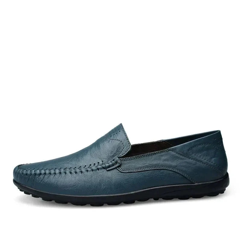Close-up men's classic Italian style loafers, showing stitching and comfortable construction. Versatile slip-on shoes.