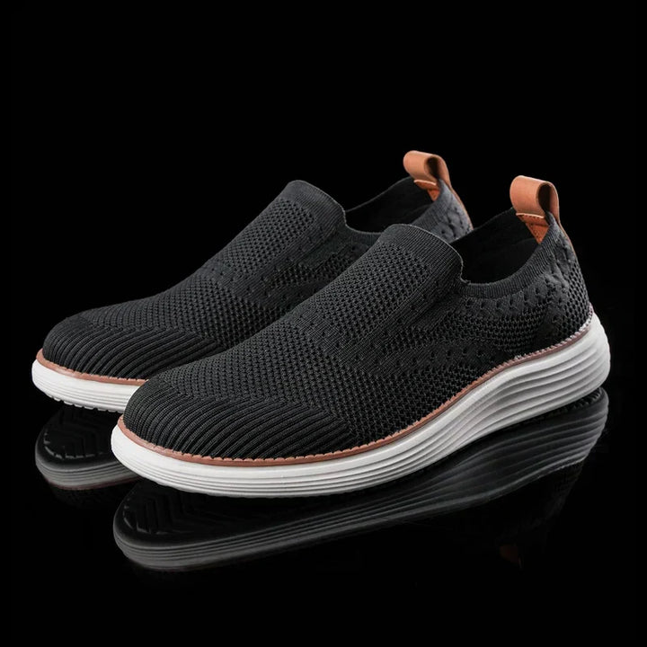 Black men's orthopedic slip-on sneakers. Comfortable, supportive footwear for active lifestyles & pain relief.