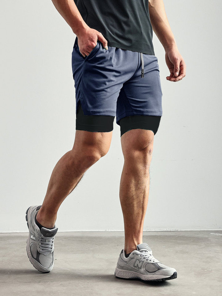 Man wearing Kinetic Mesh shorts during a workout, demonstrating unrestricted movement.