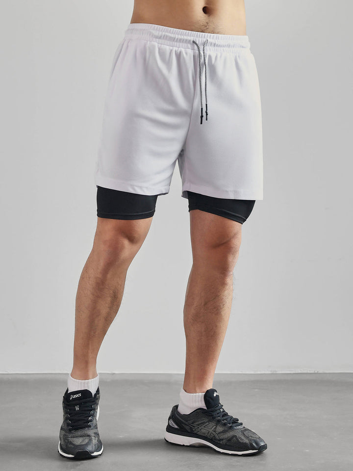 Men's Kinetic Mesh shorts with elastic waistband, ensuring secure & comfortable fit for activity.
