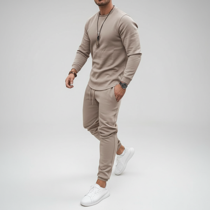 Man wearing Kirk men's tracksuit set, demonstrating comfort & flexibility for training and active sports. Activewear.