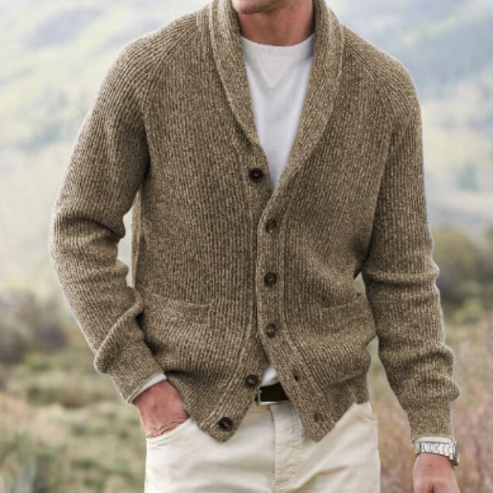 Warm men's knit cardigan featuring a classic shawl collar. Essential fall/winter layering piece for any look.