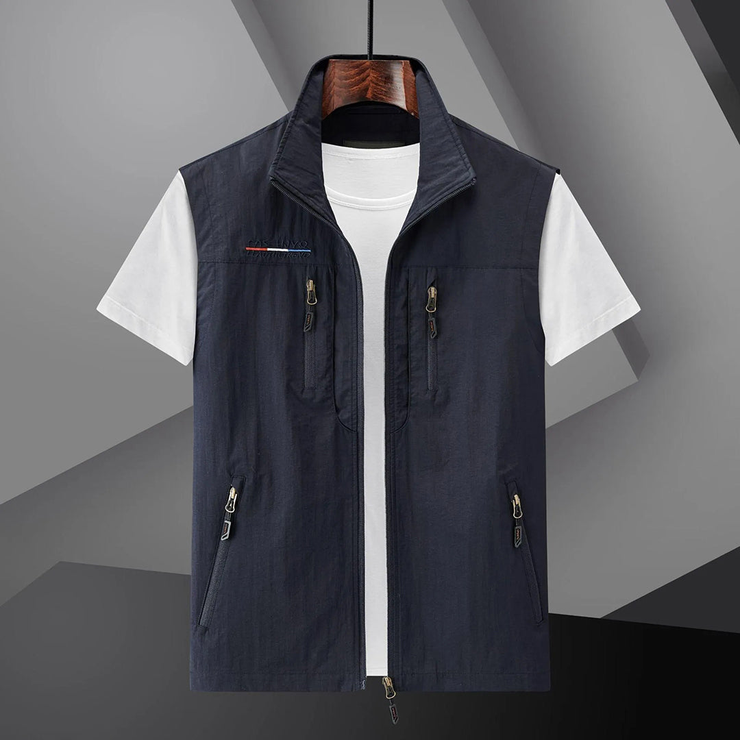 Men's lightweight adventure vest with multiple zip pockets, ideal for hiking, fishing, and outdoor travel.