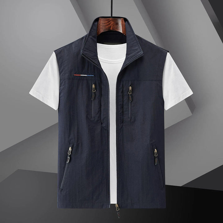 Men's lightweight adventure vest with multiple zip pockets, ideal for hiking, fishing, and outdoor travel.